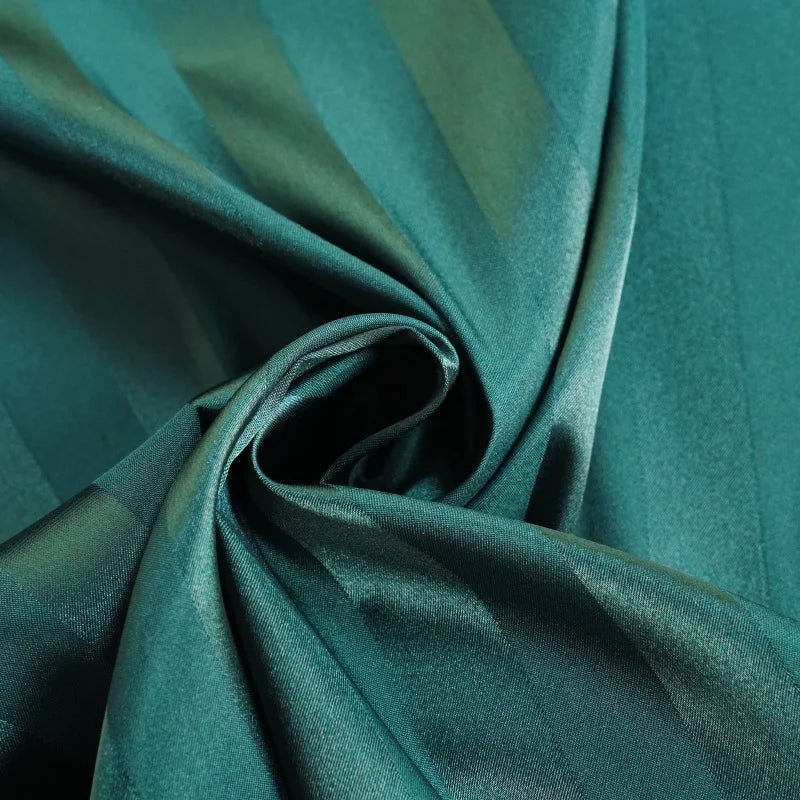 Close-up of teal fabric with folds